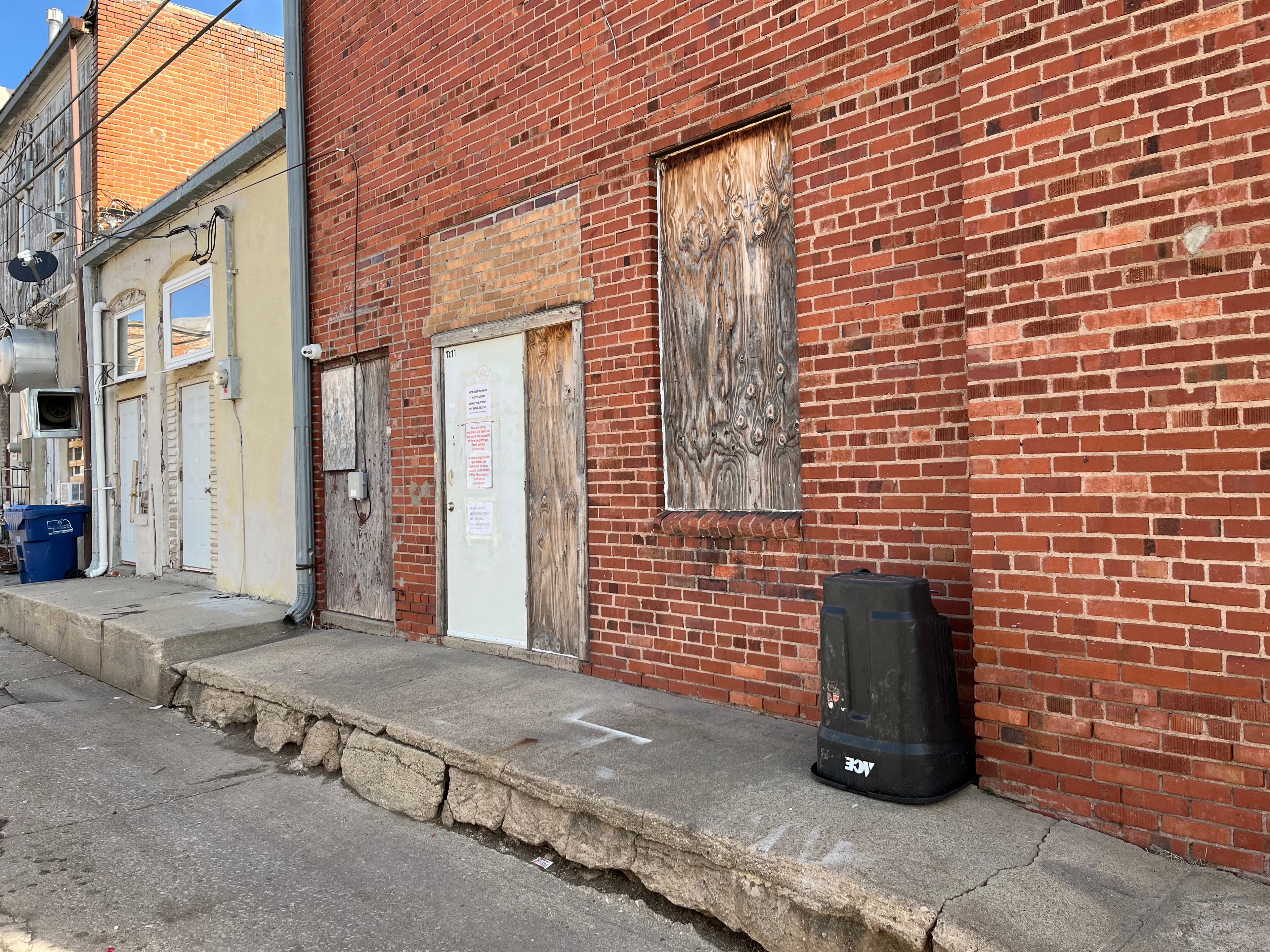 Alley donation drop-off entrance behind New Beginnings Thrift Store, between the store and the Crete Eagles Club