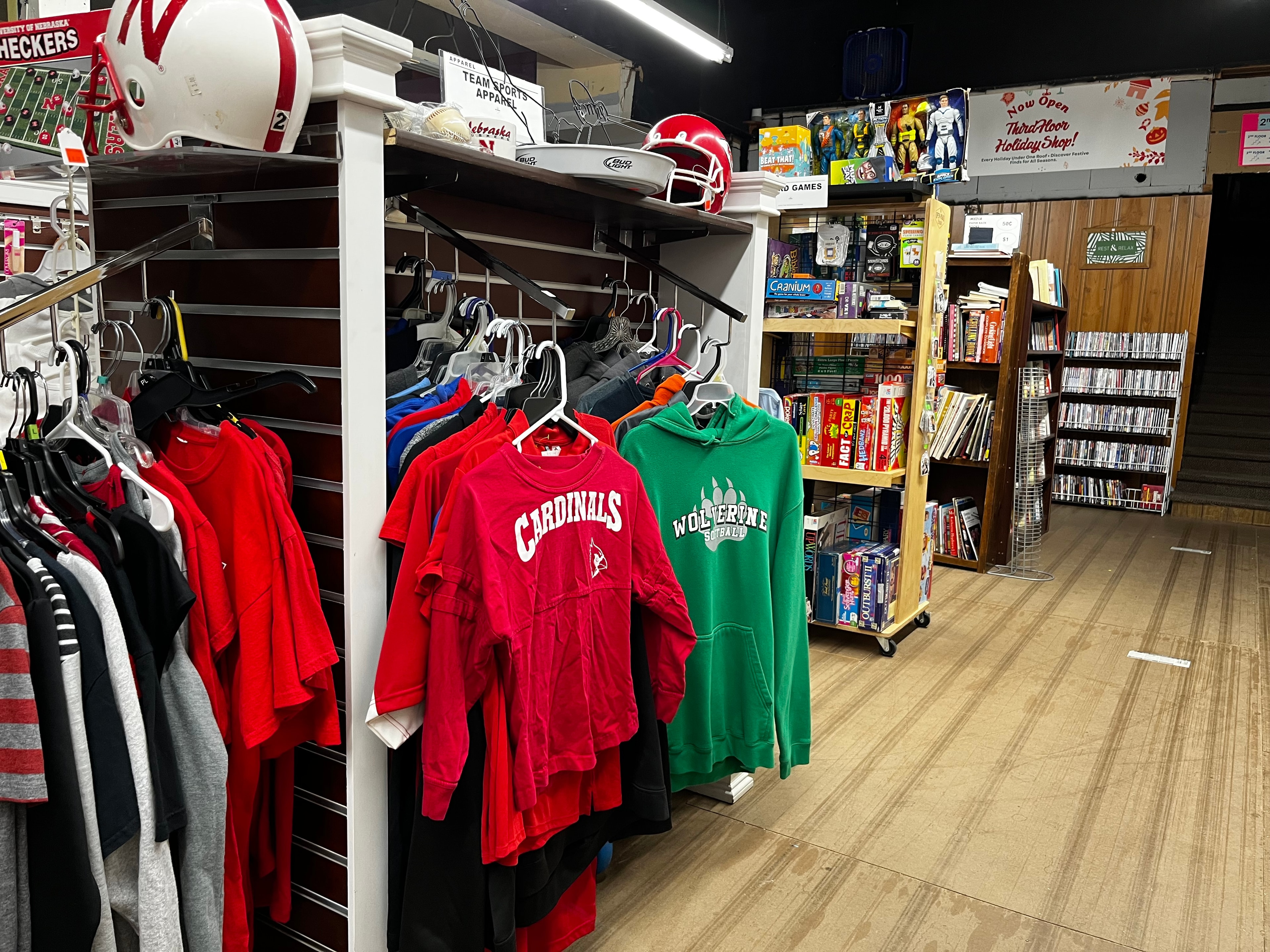 First floor team sports apparel, board games, and books section