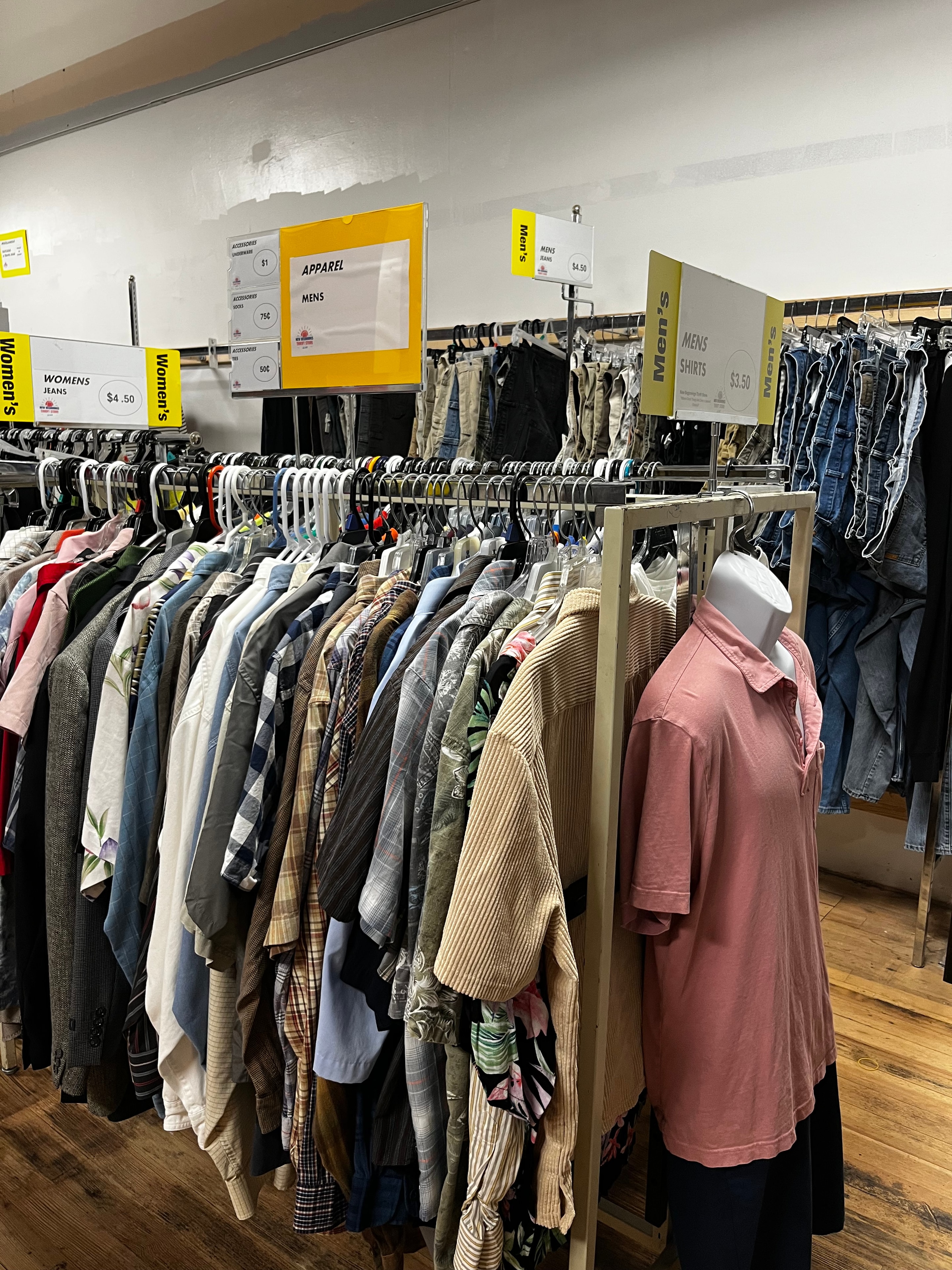 First floor mens and womens clothing racks with price signs